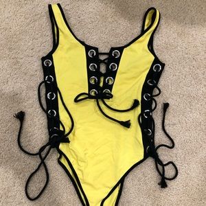 Yellow and black bodysuit, open side